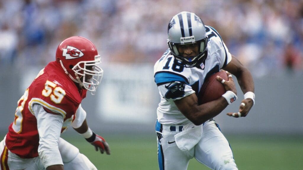 Sep 21, 1997; Charolette, NC, USA; FILE PHOTO; Carolina Panthers receiver Rae Carruth (83) carries the ball against Kansas City Chiefs linebacker Donnie Edwards (59) at Ericsson Stadium.