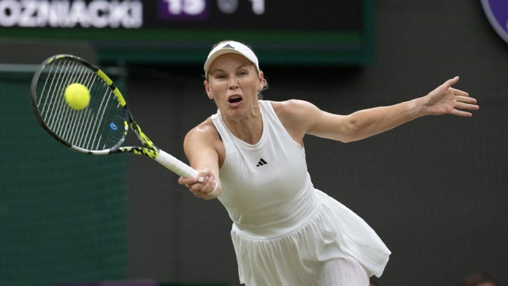 Jul 6, 2024; London,United Kingdom; Caroline Wozniacki of Denmark returns a shot during her match against Elena Rybakina of Kazakhstan (not shown) on day six of The Championships at All England Lawn Tennis and Croquet Club.