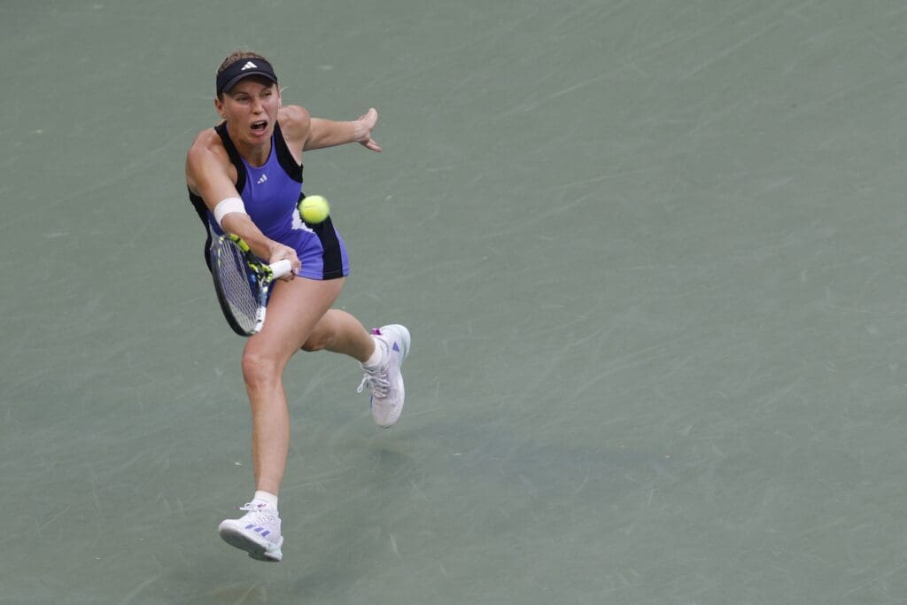 Sep 2, 2024; Flushing, NY, USA; Caroline Wozniacki (DEN) hits a forehand against Beatriz Haddad Maia (BRA)(not pictured) in a women's singles match on day eight of the 2024 U.S. Open tennis tournament at USTA Billie Jean King National Tennis Center.