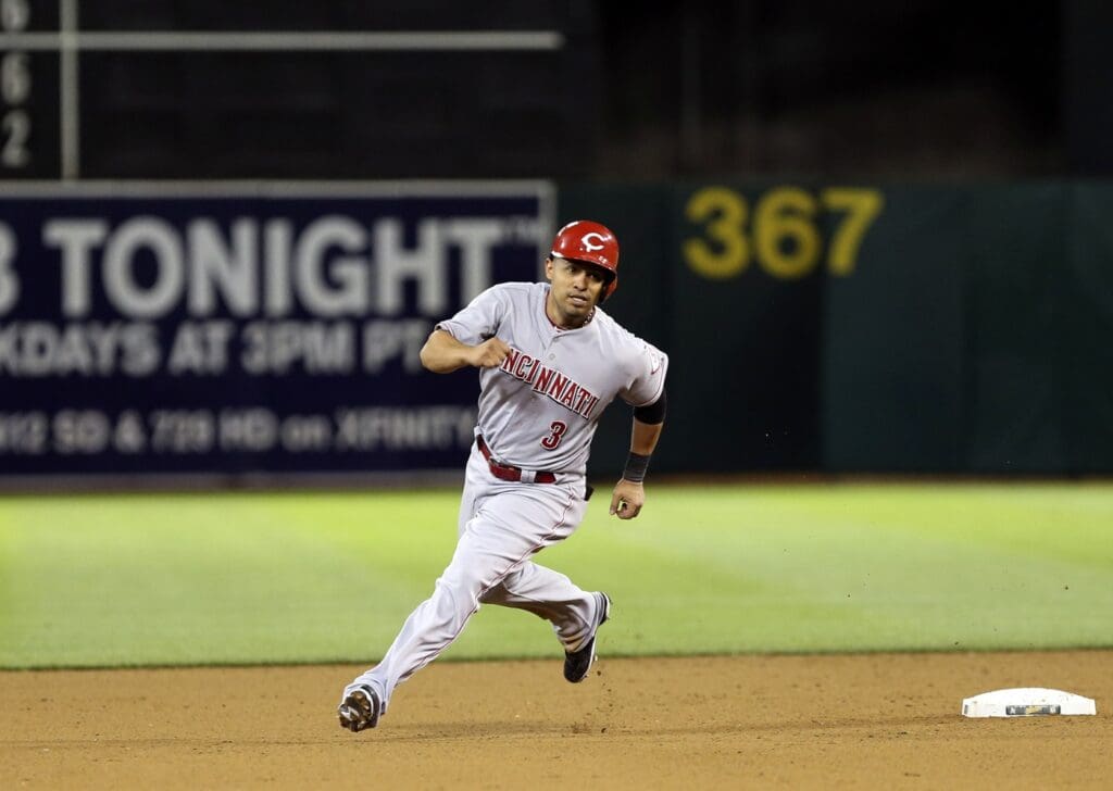 Caption:
Jun 25, 2013; Oakland, CA, USA; Cincinnati Reds shortstop Cesar Izturis (3) rounds second base against the Oakland Athletics during the eighth inning at O.co Coliseum. The Oakland Athletics defeated the Cincinnati Reds 7-3.