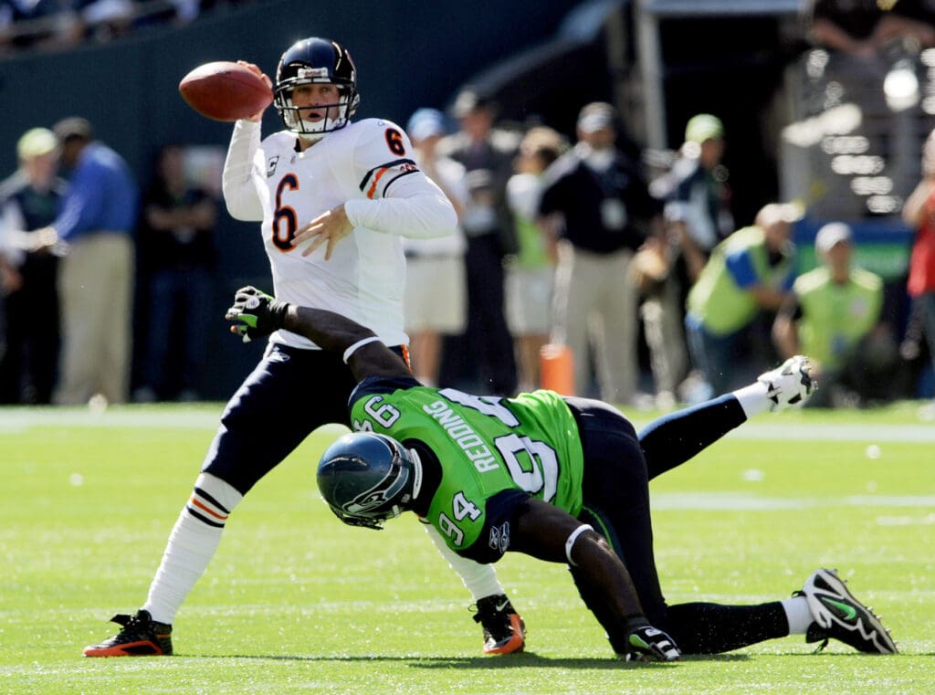 Sept 27, 2009; Seattle, WA, USA; Chicago Bears quarterback Jay Cutler (6) is pressured by Seattle Seahawks defensive tackle Cory Redding (94) in the first quarter of the game at Qwest Field.