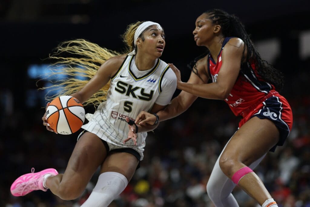 Jul 29, 2025; Washington, District of Columbia, USA; Chicago Sky forward Angel Reese (5) drives to the basket as Washington Mystics forward Kiki Iriafen (44) defends in the first half at CareFirst Arena.