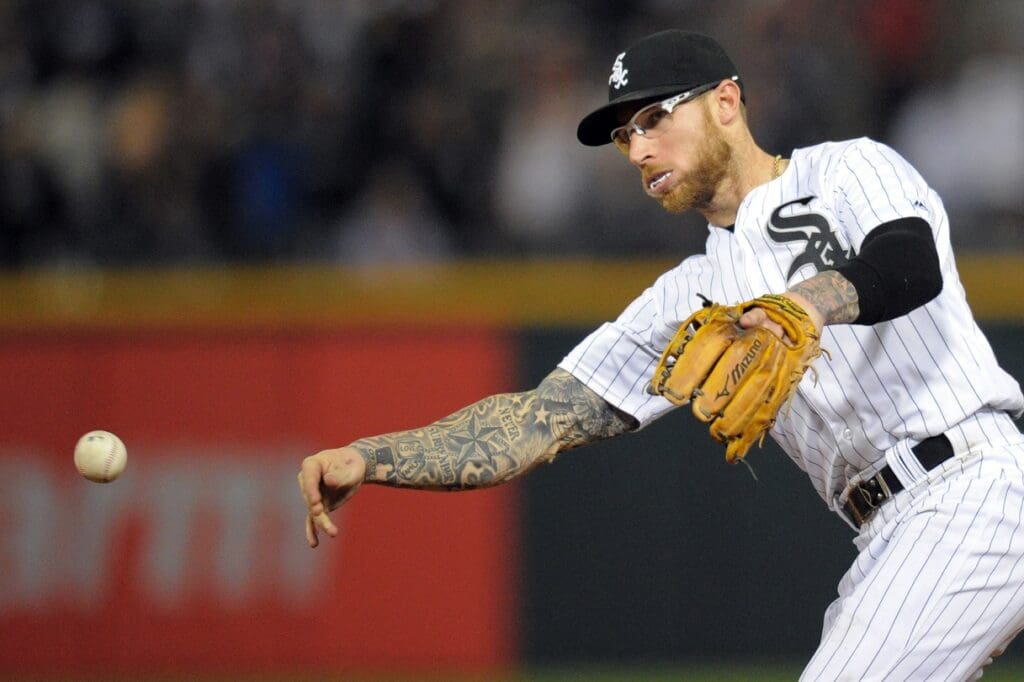May 6, 2016; Chicago, IL, USA; Chicago White Sox second baseman Brett Lawrie (15) throws after fielding a ground ball hit by Minnesota Twins center fielder Danny Santana (not pictured) to end the ninth inning at U.S. Cellular Field. The White Sox won 10-4. 