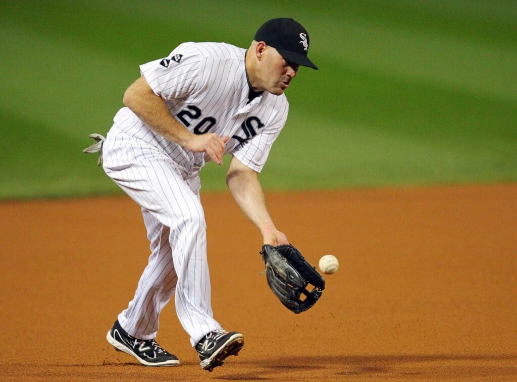 Sep 28, 2012; Chicago, IL, USA; Chicago White Sox third baseman Kevin Youkilis (20) fields a ground ball off the bat of Tampa Bay Rays center fielder B.J. Upton (not pictured) during the first inning at US Cellular Field. 