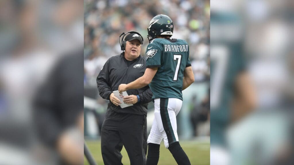 Dec 13, 2015; Philadelphia, PA, USA; Philadelphia Eagles head coach Chip Kelly (left) talks with quarterback Sam Bradford (7) in the second quarter against the Buffalo Bills at Lincoln Financial Field.