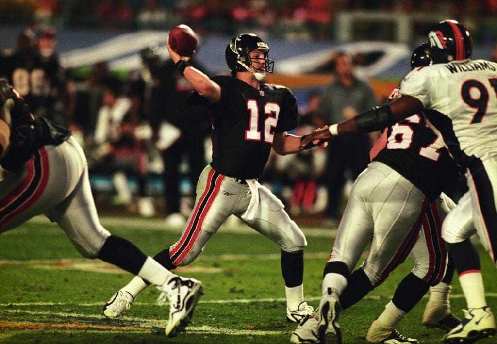 Jan 31, 1999; Miami, FL, USA; FILE PHOTO; Atlanta Falcons quarterback Chris Chandler (12) looks to throw against the Denver Broncos during Super Bowl XXXIII at Dolphin Stadium. The Broncos defeated the Falcons 34-19.