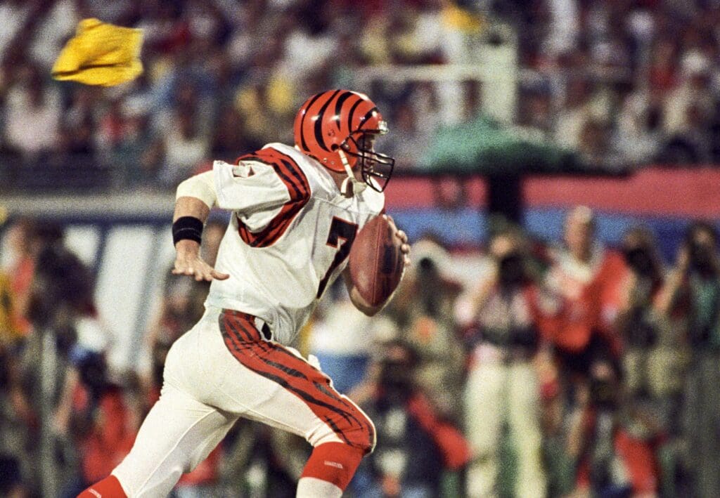 Jan 22, 1989; Miami, FL, USA; FILE PHOTO; Cincinnati Bengals quarterback Boomer Esiason (7) carries the ball against the San Francisco 49ers during Super Bowl XXIII at Joe Robbie Stadium. The 49ers defeated the Bengals 20-16.