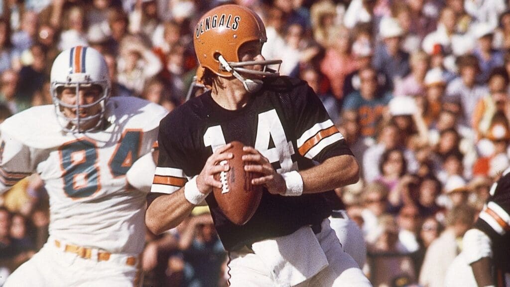 Dec 23, 1973; Miami, FL, USA; FILE PHOTO; Cincinnati Bengals quarterback Ken Anderson (14) in action against Miami Dolphins defensive end Bill Stanfill (84) during the 1973 AFC Divisional Playoffs at the Orange Bowl.