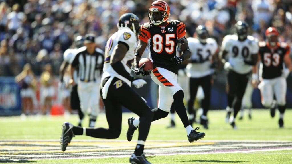Sept 7, 2008; Baltimore, MD, USA; Cincinnati Bengals wide receiver Chad Johnson (85) carries the ball after a reception as Baltimore Ravens cornerback Samari Rolle (22) defends in the third quarter at M&T Bank Stadium. Baltimore won 17-10. Chad Johnson legally changed his name to Chad Ocho Cinco but the NFL informed the Bengals that there are issues needing to be resolved before he can wear his new name on his jersey.