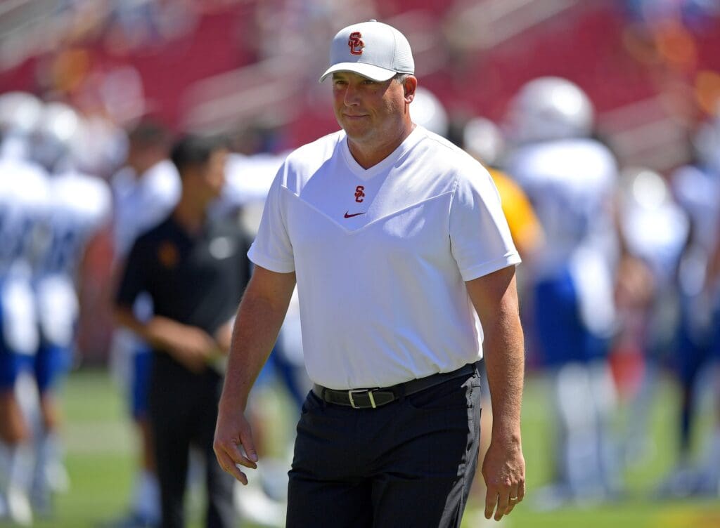 Sep 4, 2021; Los Angeles, California, USA; USC TUSC Trojans head coach Clay Helton walks on the field before the game against the San Jose State Spartans at United Airlines Field at Los Angeles Memorial Coliseum.
