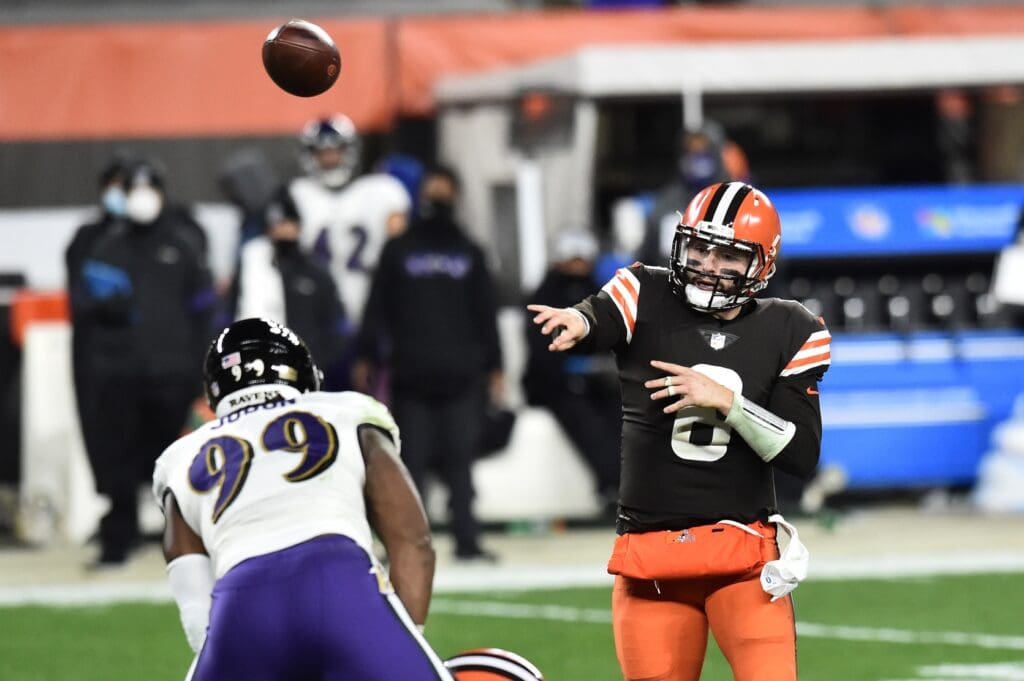 Dec 14, 2020; Cleveland, Ohio, USA; Cleveland Browns quarterback Baker Mayfield (6) throws a pass over Baltimore Ravens outside linebacker Matt Judon (99) during the first quarter at FirstEnergy Stadium.