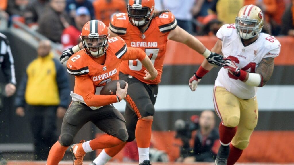 Dec 13, 2015; Cleveland, OH, USA; Cleveland Browns quarterback Johnny Manziel (2) scrambles as San Francisco 49ers nose tackle Mike Purcell (64) pursues during the fourth quarter at FirstEnergy Stadium.