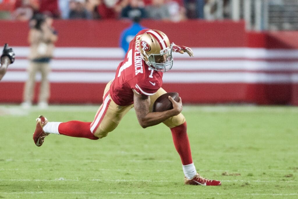 Sep 14, 2014; Santa Clara, CA, USA; San Francisco 49ers quarterback Colin Kaepernick (7) rushes for a gain against the Chicago Bears during the fourth quarter at Levi's Stadium. The Chicago Bears defeated the San Francisco 49ers 28-20.