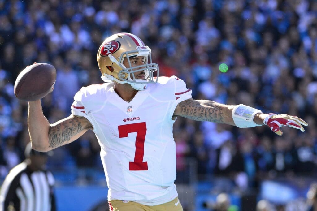 Jan 12, 2014; Charlotte, NC, USA; San Francisco 49ers quarterback Colin Kaepernick (7) looks to pass during the second quarter of the 2013 NFC divisional playoff football game at Bank of America Stadium. 
