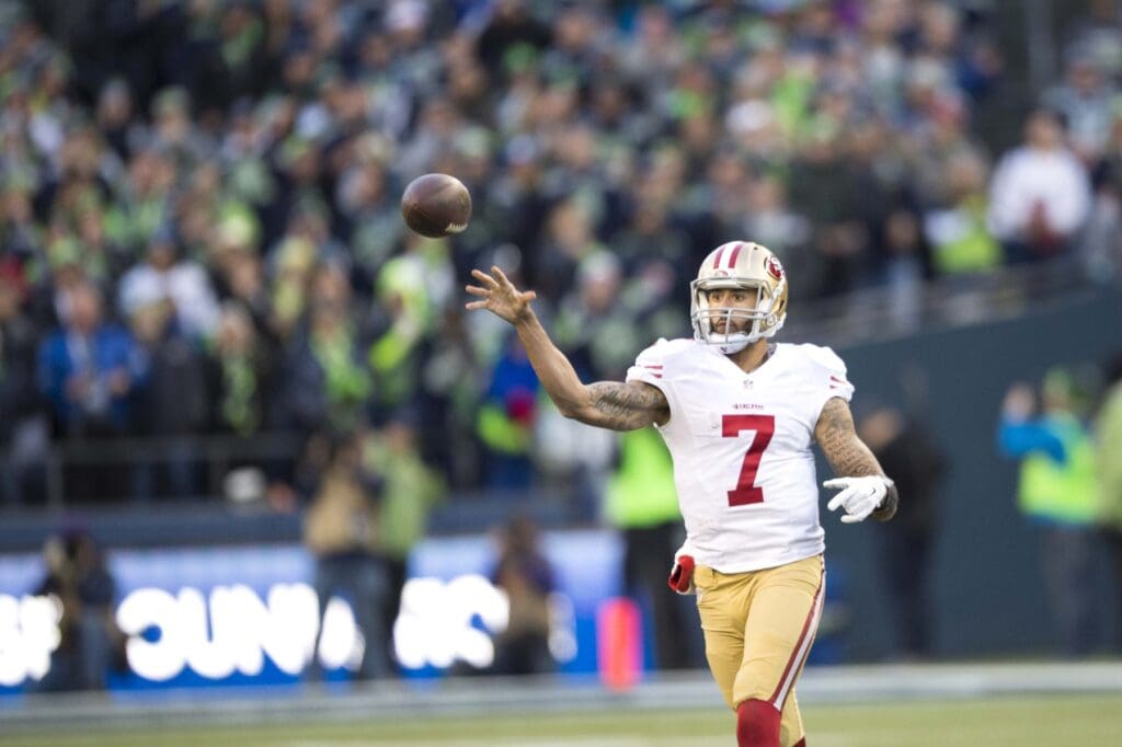 Dec 14, 2014; Seattle, WA, USA; San Francisco 49ers quarterback Colin Kaepernick (7) passes the ball against the Seattle Seahawks during the second half at CenturyLink Field. Seattle defeated San Francisco 17-7.