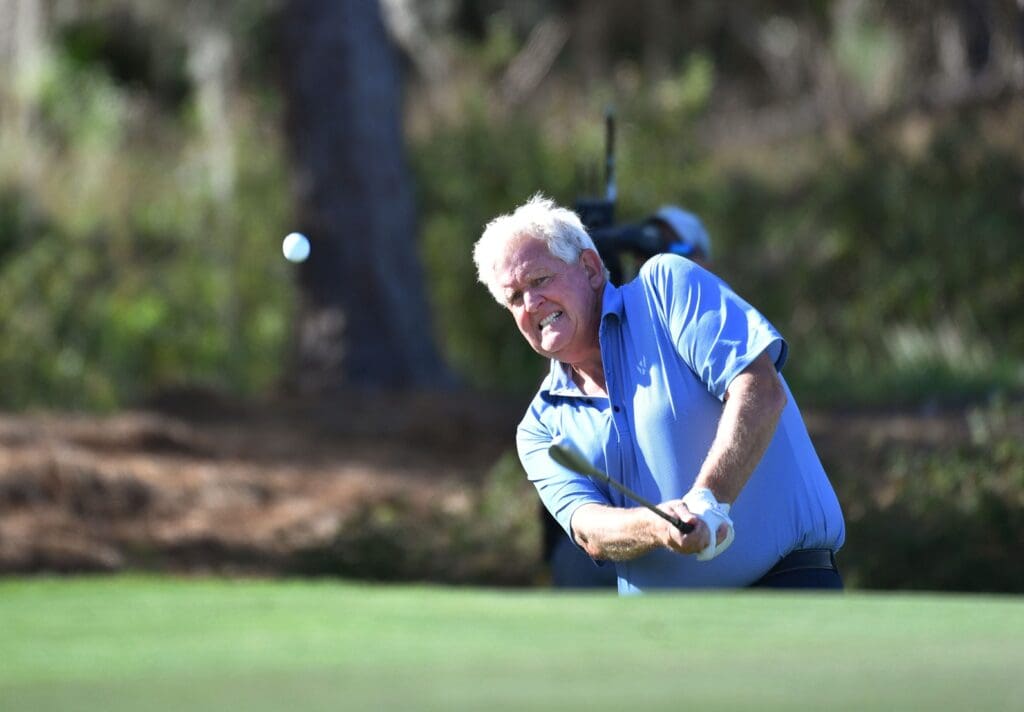 Team Europe member Colin Montgomerie chips onto the par three, fifth hole on the first day of competition of the inaugural World Champions Cup three-day, three-team competition Wednesday, Dec. 7, 2023 at The Concession Golf Club in Bradenton, Florida.
