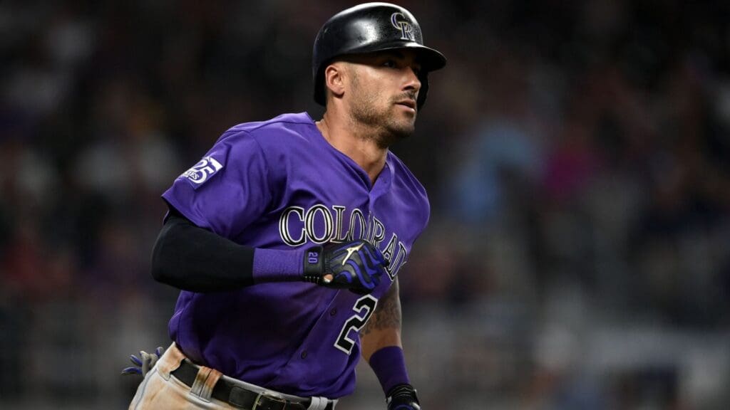 Aug 17, 2018; Atlanta, GA, USA; Colorado Rockies first baseman Ian Desmond (20) hits an RBI against the Atlanta Braves during the eighth inning at SunTrust Park.