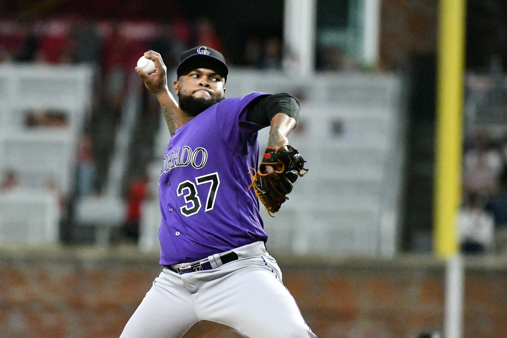 Aug 31, 2022; Cumberland, Georgia, USA; Colorado Rockies relief pitcher Alex Colome (37) throws a pitch in the seventh inning against the Atlanta Braves at Truist Park.