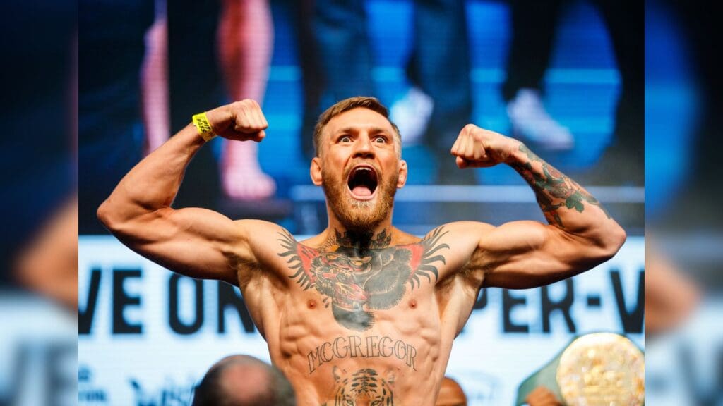 Aug 25, 2017; Las Vegas, NV, USA; Conor McGregor flexes as he stands on the scale during weigh ins for the upcoming boxing match at T-Mobile Arena.