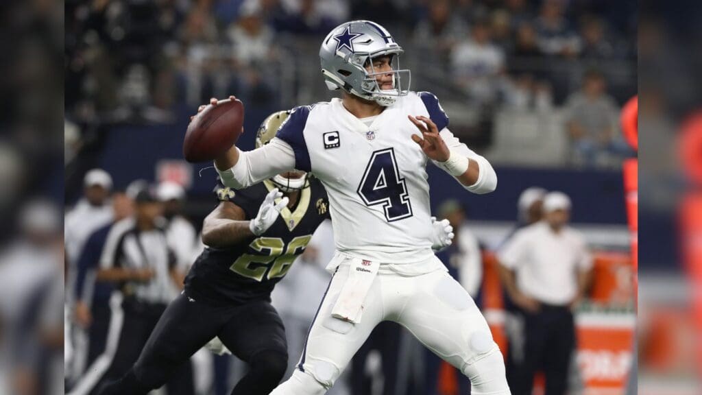 Nov 29, 2018; Arlington, TX, USA; Dallas Cowboys quarterback Dak Prescott (4) throws in the pocket in the first quarter against the New Orleans Saints at AT&T Stadium.