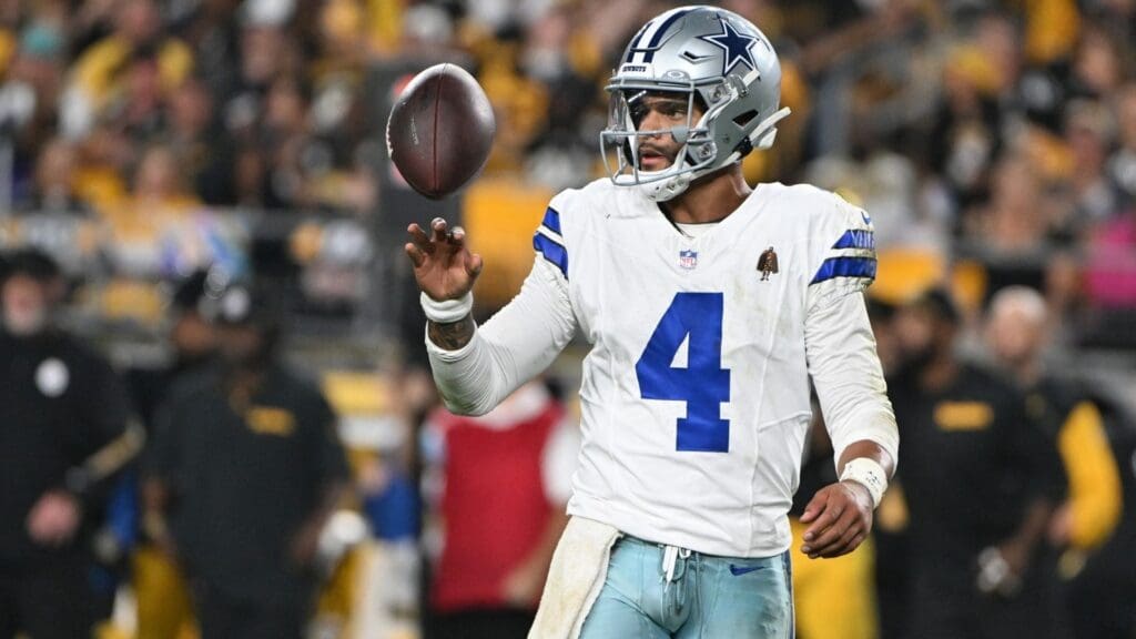 Oct 6, 2024; Pittsburgh, Pennsylvania, USA; Dallas Cowboys quarterback Dak Prescott (4) spins the ball between plays against the Pittsburgh Steelers during the fourth quarter at Acrisure Stadium.