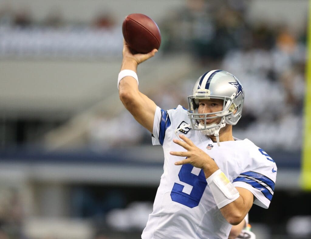 Dec 15, 2013; Arlington, TX, USA; Dallas Cowboys quarterback Tony Romo (9) throws prior to the game against the Green Bay Packers at AT&T Stadium.