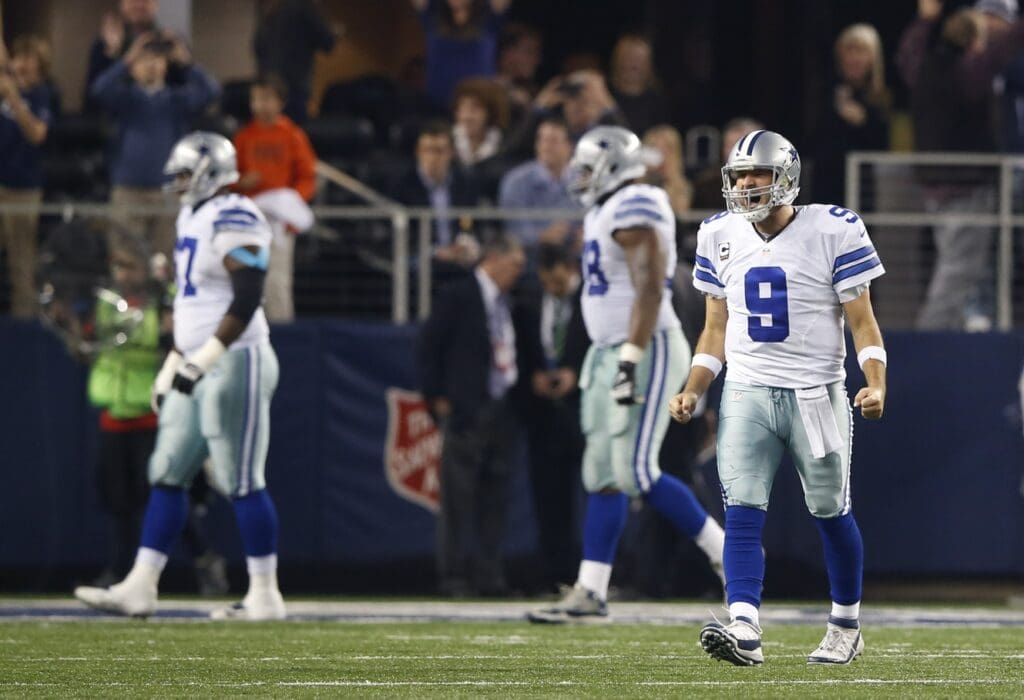 Jan 4, 2015; Arlington, TX, USA; Dallas Cowboys quarterback Tony Romo (9) reacts during the game against the Detroit Lions in the NFC Wild Card Playoff Game at AT&T Stadium.