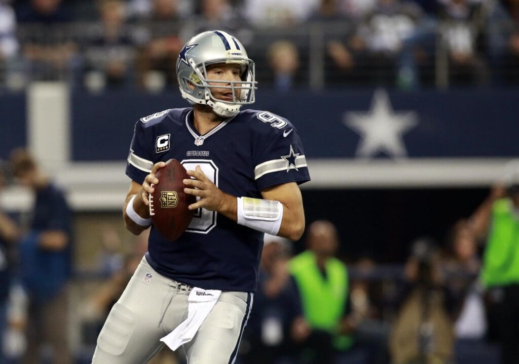 Nov 28, 2013; Arlington, TX, USA; Dallas Cowboys quarterback Tony Romo (9) in the pocket against the Oakland Raiders during a NFL football game on Thanksgiving at AT&T Stadium.