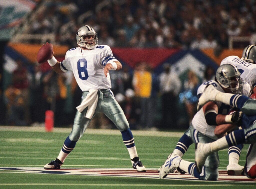Jan 30, 1994; Atlanta, GA, USA; FILE PHOTO; Dallas Cowboys quarterback Troy Aikman (8) looks to throw against the Buffalo Bills during Super Bowl XXVIII at the Georgia Dome. Dallas defeated Buffalo 30-13.
