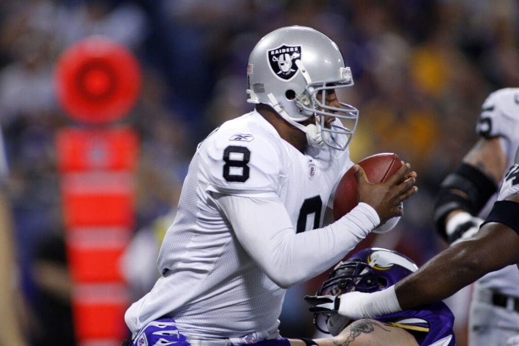 Nov 18, 2007; Minneapolis, Minnesota, USA: Oakland Raiders quarterback (8) Daunte Culpepper tries to elude the Minnesota Vikings in his own end zone but gets called for intentional grounding and a safety in the first quarter at the Metrodome