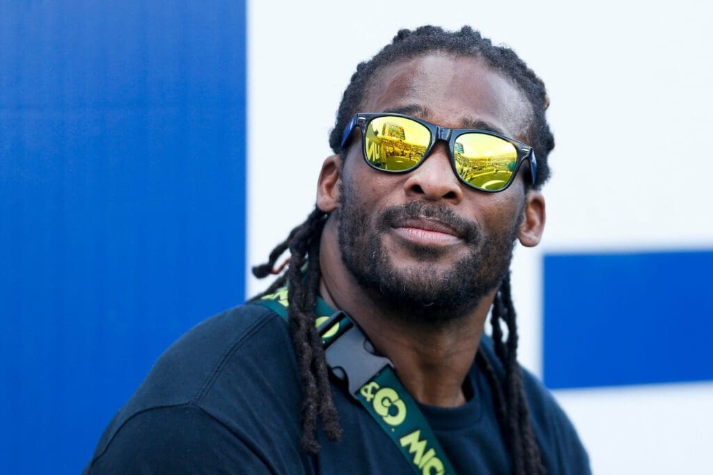 Former Memphis and NFL running back DeAngelo Williams smiles while looking at the scoreboard on the sideline during the game between University of Memphis and Boise State University in Memphis, Tenn., on Saturday, September 30, 2023. The 2003 Memphis football team, which Williams was a part of, was honored during the game.