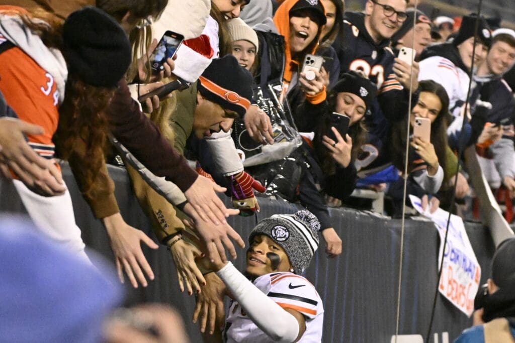 Dec 24, 2023; Chicago, Illinois, USA; Chicago Bears quarterback Justin Fields (1) greets fans after the second half against the Arizona Cardinals at Soldier Field.