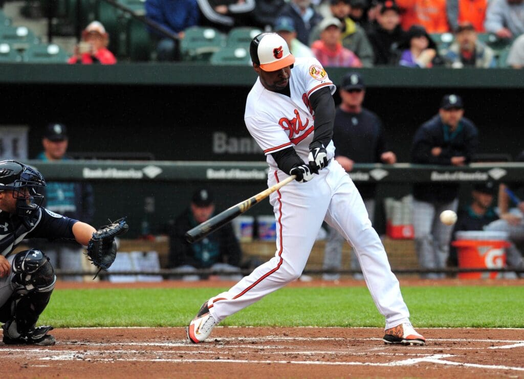 May 21, 2015; Baltimore, MD, USA; Baltimore Orioles outfielder Delmon Young (27) singles in the first inning against the Seattle Mariners at Oriole Park at Camden Yards.