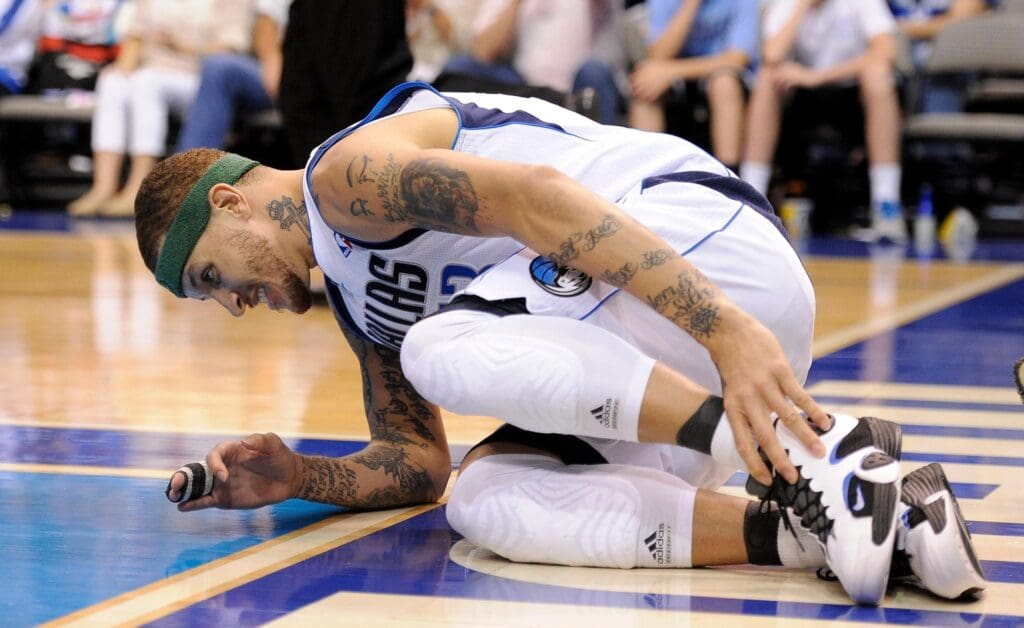 Apr 6, 2012; Dallas, TX, USA; Dallas Mavericks shooting guard Delonte West (13) reacts after an injury during the second quarter against the Portland Trail Blazers at the American Airlines Center.