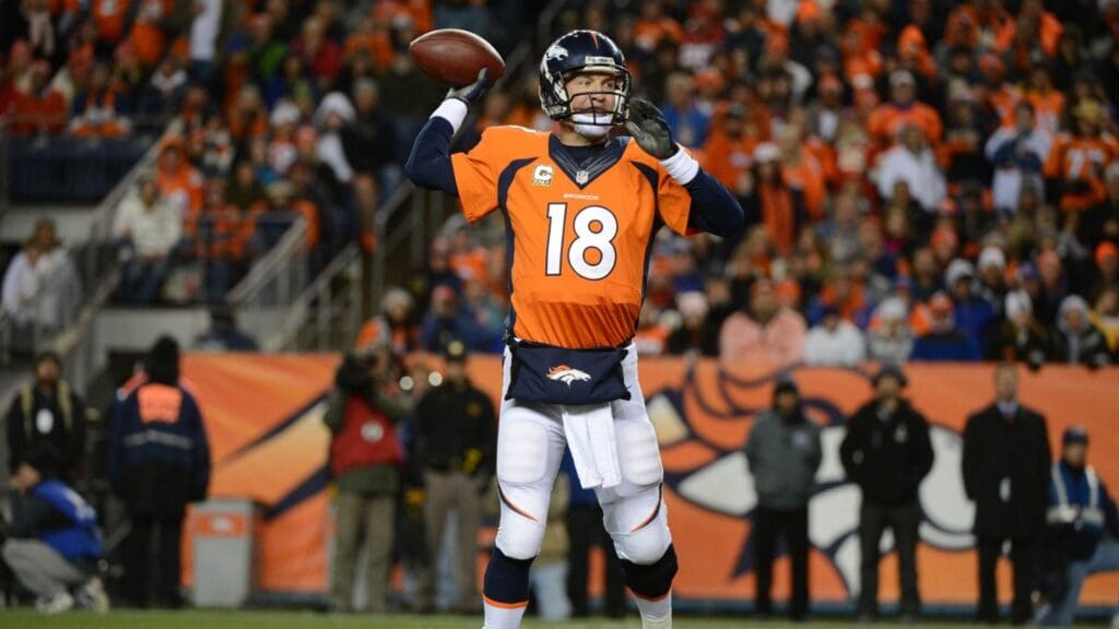 November 17, 2013; Denver, CO, USA; Denver Broncos quarterback Peyton Manning (18) passes the football during the third quarter against the Kansas City Chiefs at Sports Authority Field at Mile High. The Broncos defeated the Chiefs 27-17.