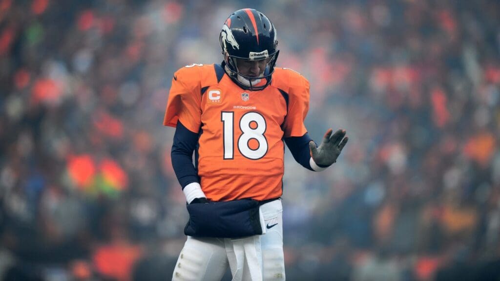 Jan 12, 2013; Denver, CO, USA; Denver Broncos quarterback Peyton Manning (18) reacts against the Baltimore Ravens during the AFC divisional round playoff game at Sports Authority Field.