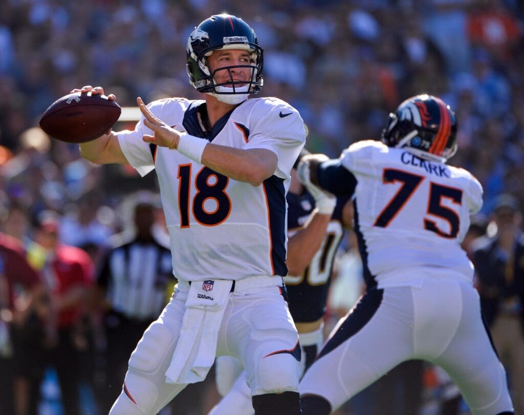 Nov 10, 2013; San Diego, CA, USA; Denver Broncos quarterback Peyton Manning (18) throws a 74 yard touchdown pass to Julius Thomas (not pictured) in the first quarter against the San Diego Chargers at Qualcomm Stadium. 