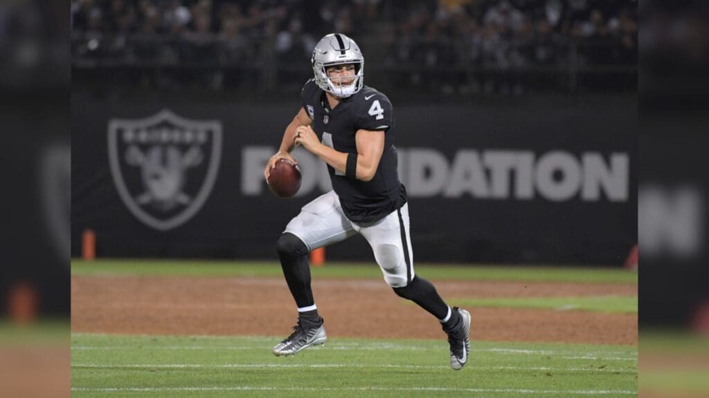 Sep 10, 2018; Oakland, CA, USA; Oakland Raiders quarterback Derek Carr (4) prepares to throw the ball against the Los Angeles Rams at the Oakland-Alameda County Coliseum. The Rams defeated the Raiders 33-13.