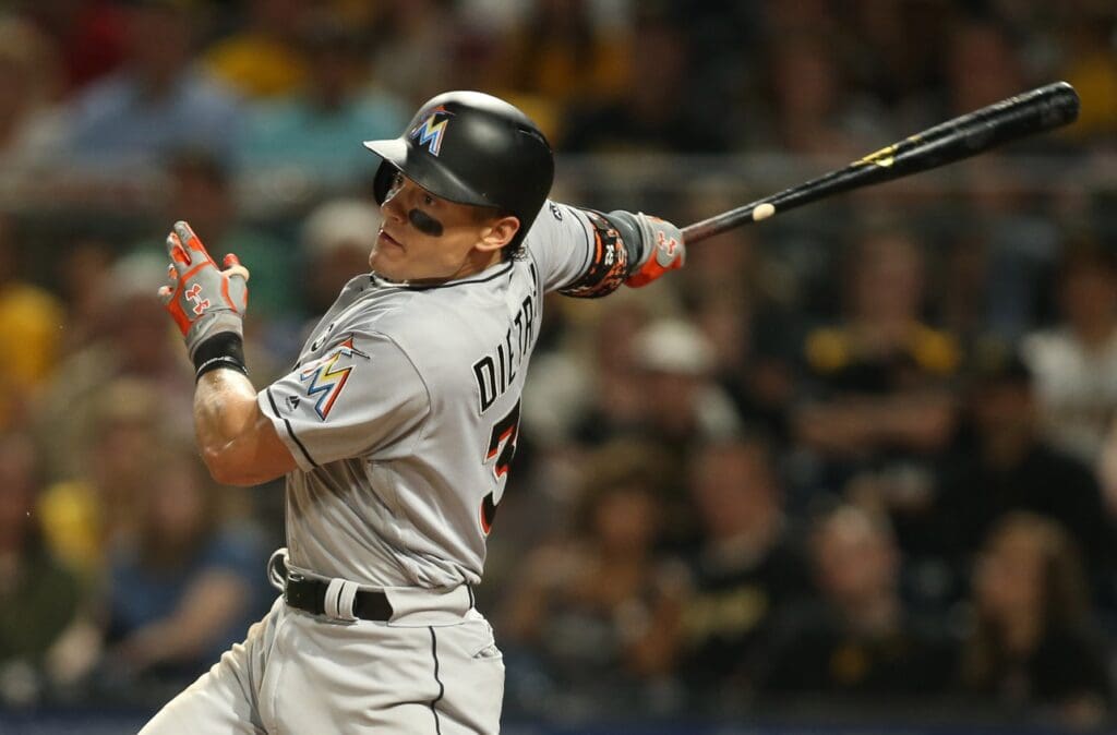 Jun 9, 2017; Pittsburgh, PA, USA; Miami Marlins third baseman Derek Dietrich (32) drives in a run against the Pittsburgh Pirates during the eighth inning at PNC Park.