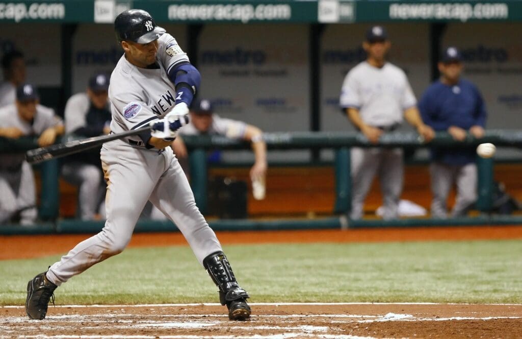 April 14, 2008; St. Petersburg, FL, USA; New York Yankees shortstop Derek Jeter (2) gets a hit scoring 2 runs against the Tampa Bay Rays in the fourth inning at Tropicana Field.