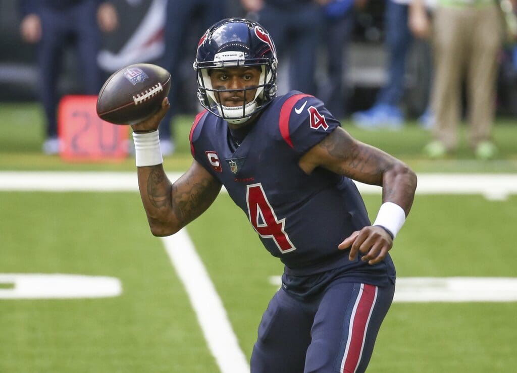 Dec 27, 2020; Houston, Texas, USA; Houston Texans quarterback Deshaun Watson (4) rolls out of the pocket against the Cincinnati Bengals during the third quarter at NRG Stadium. 