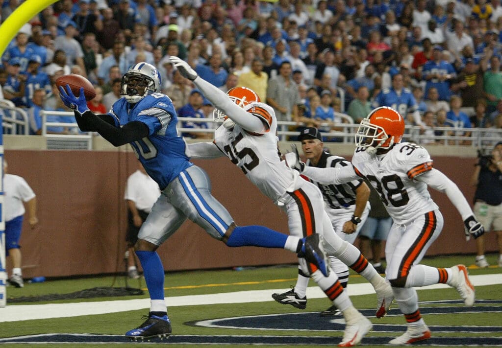 Aug 20, 2005; Detroit, MI, USA; Detroit Lions #80 Charles Rogers catches a touchdown from #5 Jeff Garcia against the Cleveland Browns #25 Chris Crocker and #38 Ray Mikens to put the Lions up 10-7 in the first half at Ford Field.