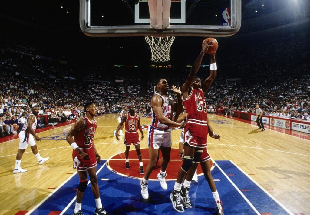 May 1989; Detroit, MI, USA; FILE PHOTO; Detroit Pistons center Rick Mahorn defends as Chicago Bulls forward Horace Grant (54) grabs a rebound during the 1989 Eastern Conference Finals at the Silverdome. 