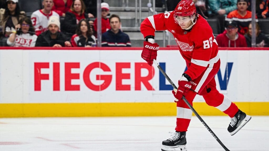 Apr 4, 2025; Detroit, Michigan, USA; Detroit Red Wings right wing Patrick Kane (88) shoots and scores a goal during the second period against the Carolina Hurricanes at Little Caesars Arena.