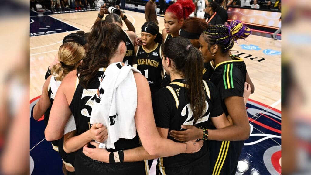 Jul 26, 2025; Washington, District of Columbia, USA; Washington Mystics team members huddle at the end of the game to celebrate a win against the Seattle Storm at CareFirst Arena