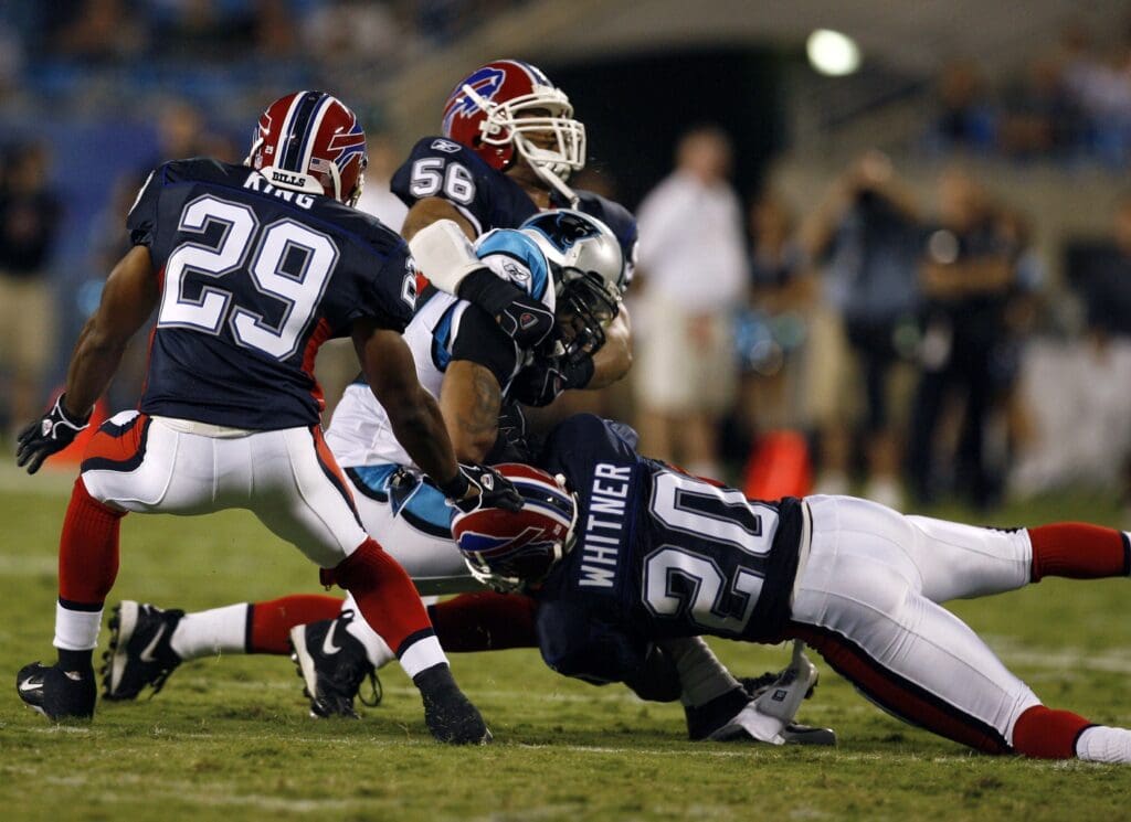 Aug 12, 2006, Charlotte, NC, USA; Carolina Panthers wide receiver (88) Karl Hankton is tackled by Buffalo Bills safety (20) Donte Whitner - linebacker (56) Courtney Watson and cornerback (29) Eric King in the Panthers 14-13 victory against the Bills at Bank of America Stadium