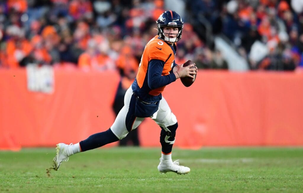 Dec 29, 2019; Denver, Colorado, USA; Denver Broncos quarterback Drew Lock (3) scrambles with the ball in the second half against the Oakland Raiders at Empower Field at Mile High.