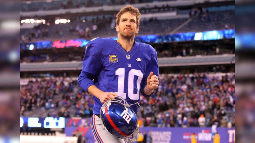 Dec 20, 2015; East Rutherford, NJ, USA; New York Giants quarterback Eli Manning (10) runs off the field after losing to the Carolina Panthers at MetLife Stadium. The Panthers defeated the Giants 38-35.