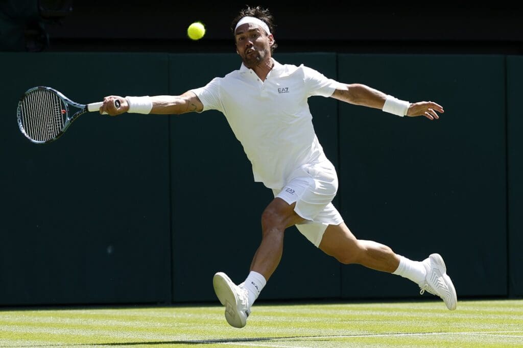 Jun 30, 2025; Wimbledon, United Kingdom; Fabio Fognini (ITA) reaches for a forehand against Carlos Alcaraz (ESP)(not pictured) on day one of The Championships, Wimbledon 2025 at All England Lawn Tennis and Croquet Club.