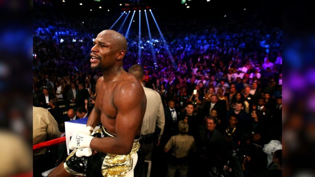 May 2, 2015; Las Vegas, NV, USA; Floyd Mayweather celebrates on the ropes after his welterweight championship bout against Manny Pacquiao at MGM Grand Garden Arena.